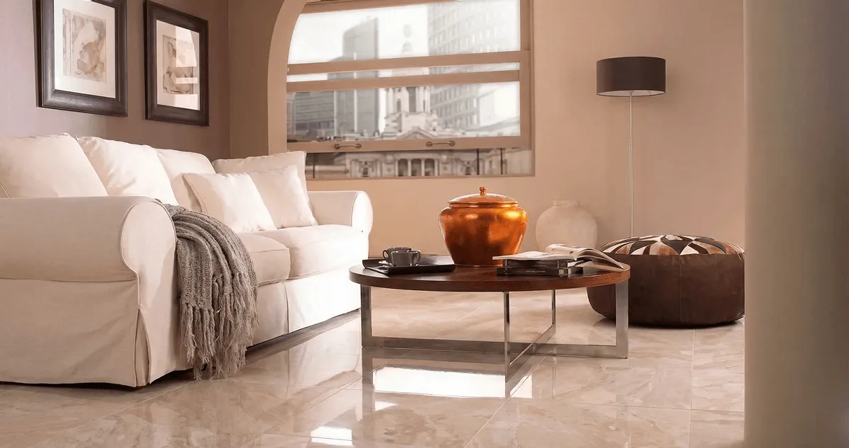 Modern living room with professionally installed marble flooring, a beige sofa, coffee table in Columbia, MO