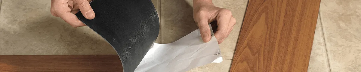 A professional installing vinyl flooring in Columbia, MO